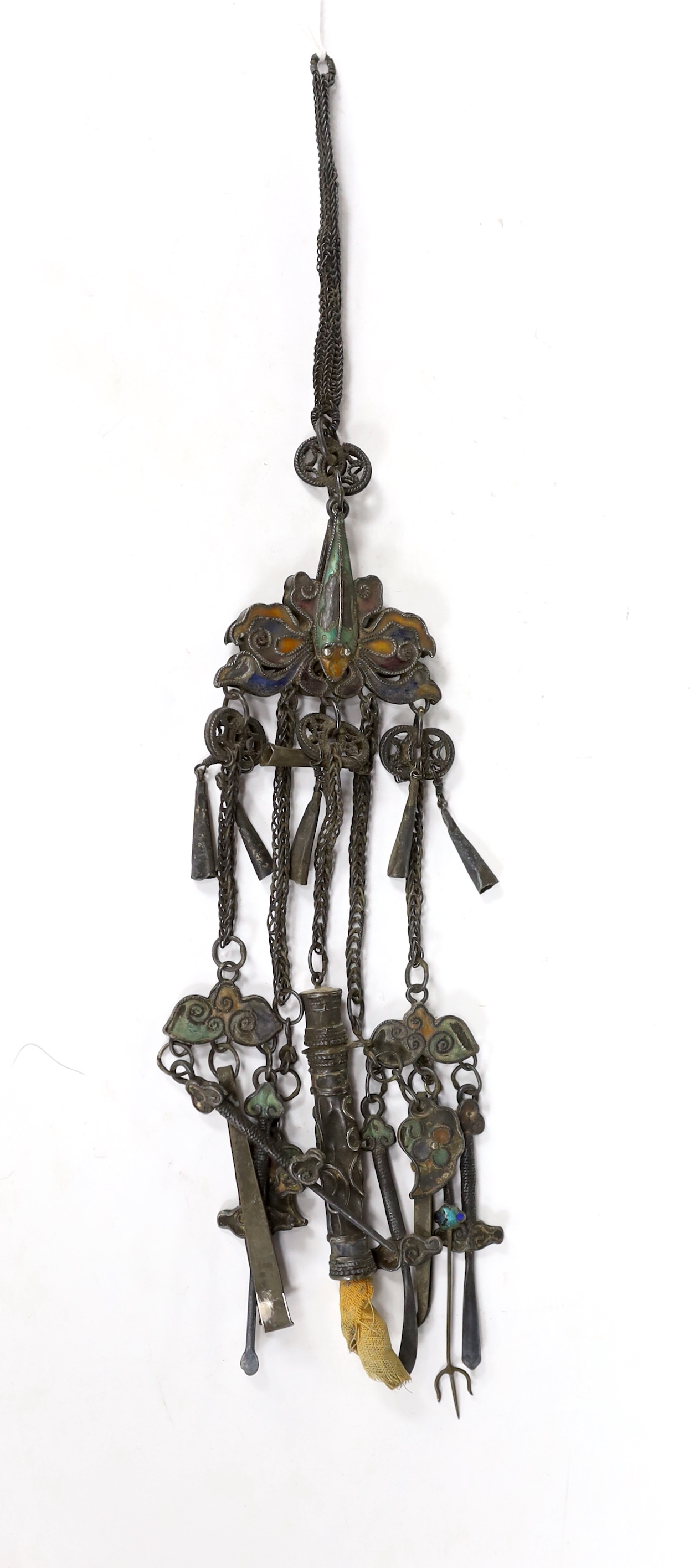 A 19th century continental white metal and polychrome enamel chatelaine, hung with assorted implements, 37cm.
